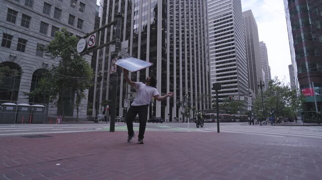 Man Catching Large Sign Mid-Air on Market Street In San Francisco - Low, Steady Cam Shot