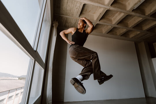 Contemporary dancer jumping in studio