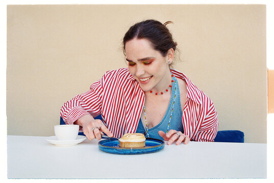 Woman enjoys dessert and coffee