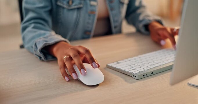 Close up of African American woman hands using mouse and keyboard at office desk