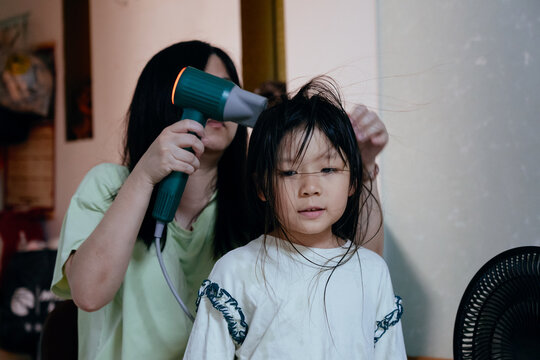 Child Gets Hair Dried in a Home Setting