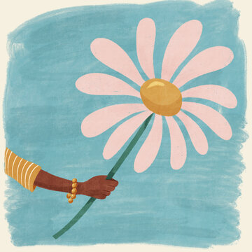 Hand holding out an oversized pink flower