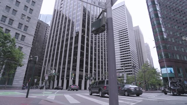 Cars Passing Downtown Intersection at Street Level In San Francisco