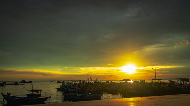 Traditional Vietnamese fishing boat silhouette at sunset, Ly Son Island, Quang Ngai Province, Vietnam