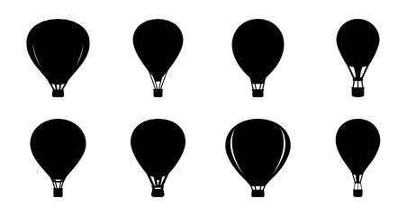 Black hot air balloons floating in sky - A set of stylish black hot air balloons with baskets, floating calmly against a clean sky. Perfect for travel, adventure, or event themes. © MST
