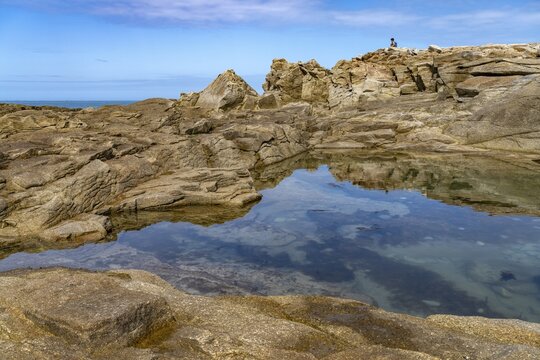 Natural pool among the rocks of the pink granite coast C&ocirc;te de Granit Rose on the island Ile Grande, Pleumeur-Bodou, Brittany, France
