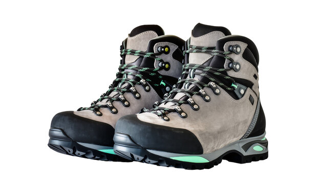 Isolated pair of modern trekking boots with vibrant mint green accents for outdoor adventures