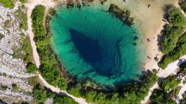 Aerial view of the Cetina River spring, known as the Eye of the Earth, a karst water source in Croatia
