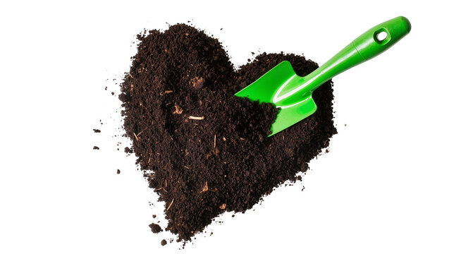 Isolated heart shape made of rich organic soil with a vibrant green gardening trowel ready to plant.