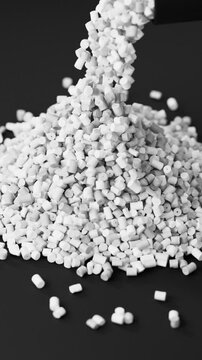 Black polypropylene plastic granules pouring from a cup onto a resin pellet pile on black background, 3D render dynamic Vertical video.