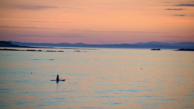 Paddleboarder at Sunset on the Firth of Forth, North Berwick, Scotland