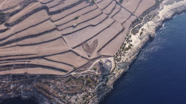 Mgarr ix-Xini Tower, Aerial view, with Heart on the agricultural field nearby. Gozo, Malta. High quality 4k footage