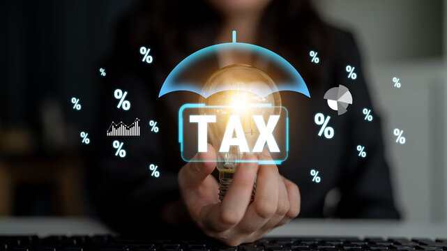 Business Person Holding Light Bulb Under Umbrella with Tax Concept Illustration and Percentage Symbols in Modern Office Setting. Sentient.