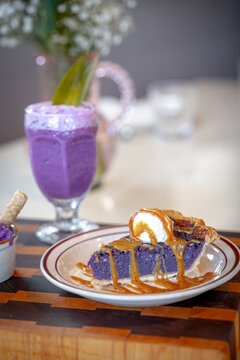 Drinks and desserts made from ube edible purple yam displayed on a restaurant table