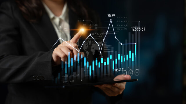A business professional interacts with a holographic financial data display, showcasing growth trends and analytics in a modern corporate setting with touch technology. Scalp