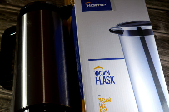 Cairo, Egypt, July 3 2026: a Home brand stainless steel vacuum flask, designed for keeping beverages hot or cold, The flask features a glass inner liner for insulation and a silver black color scheme