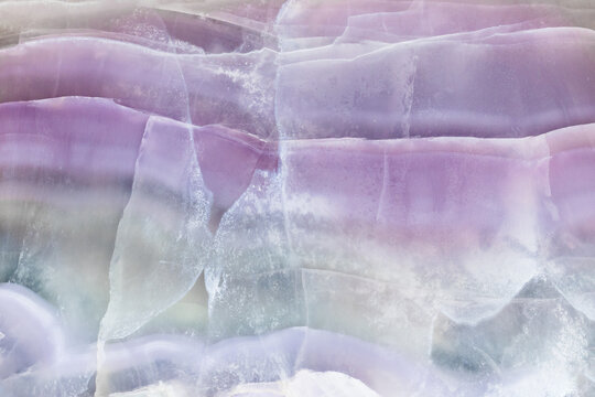 surface of polished natural striped fluorite rock
