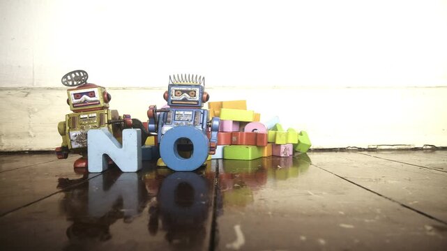 retro robot toys say NOT AI with wooden letters stop motion 