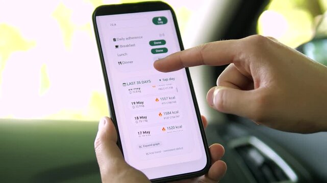 Clean mobile UI for fitness analytics. User interacts with a detailed popup to switch between calorie intake and body weight graphs over a 35-day period. 