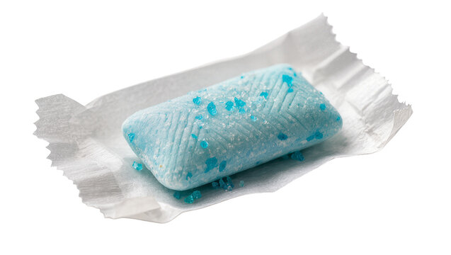Isolated unwrapped light blue chewing gum candy with sparkling sugar crystals on white paper