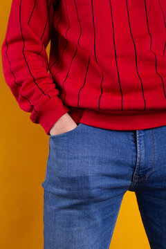 a young guy with skinny legs in jeans, below the waist: a fly and pockets for money or condoms. a pose from psychology: waiting in a store queue or on a date with a girl. street style in clothing: cla