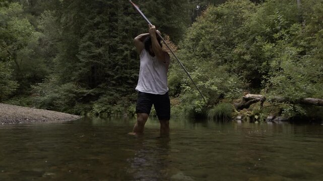 Man Doing Epic Tricks With Large Board In Shallow River - Wide Slow Motion Shot