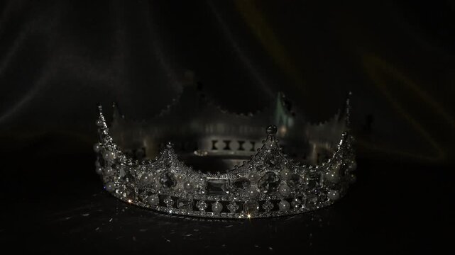 Golden crown with dramatic light on dark background, symbol of authority and prestige. The interplay of shadow and reflection conveys authority, prestige and elevated power.