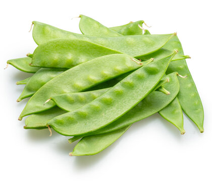 A loose pile of fresh, young green snow peas in pods, isolated on a white background.
