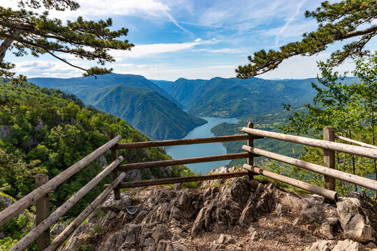 High angle perspective of an empty wooden observation deck overlooking the spectacular mountain vistas in Tara National Park. Serbia
