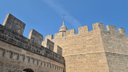 Historic stone fortress walls under blue sky © Studio-M