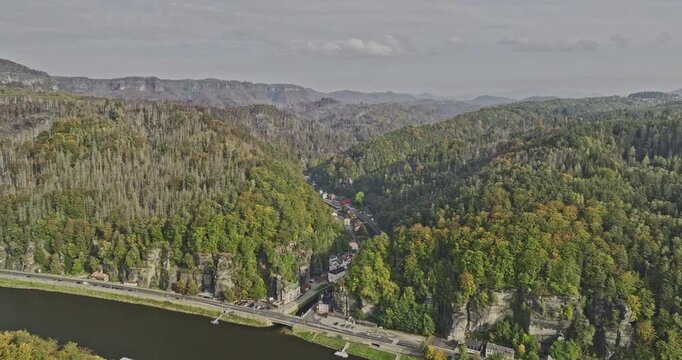 Hrensko Czechia Aerial v9 flyover Elbe river border towards secluded small village town along Kamenice narrow gorge capturing mountain forest lush environments - Shot with Mavic 3 Cine - November 2022