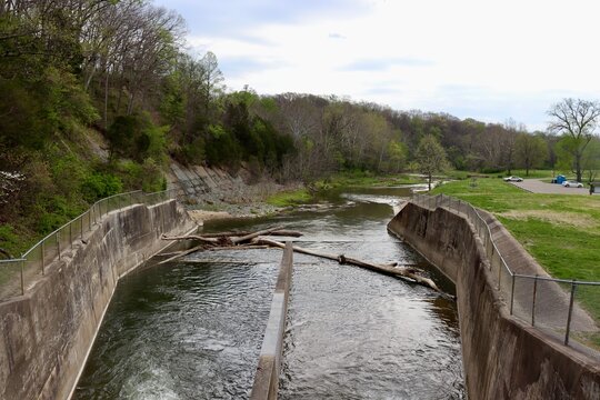 The flowing water out of the dam spillway.