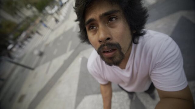 Young Man Looking Up From San Francisco Plaza Steps - Close-Up Fish-Eye Shot