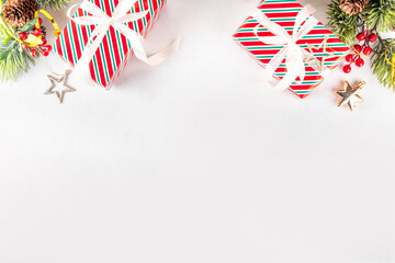 White background with Christmas border with gifts and holiday baubles