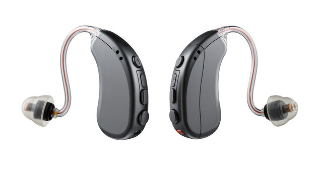 Isolated modern dark gray digital hearing aids with clear tubes and earpieces, studio shot
