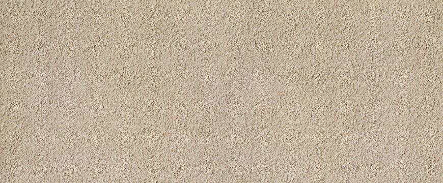 Gritty beige plaster wall texture background