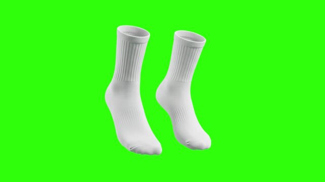 A pair of blank white athletic crew socks floating against a solid green chroma key background. Perfect for clothing brand marketing, e-commerce product videos, and fashion animations.