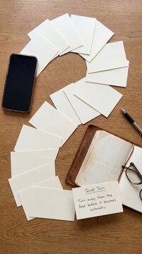 Smartphone and Stationery Laid Out for a Digital Detox Session with Notebook and Pen