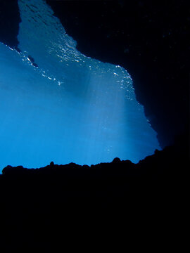 Cathedrals of light. Underwater photo of a dreamlike and etheral environment. From cave scuba dive in rays of sunlight. Unspecified.