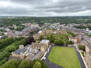 Durham City Center Landscape: A spectacular overlook captures Durham's ancient stone structures and pristine green pastures radiating outward into a sprawling modern city. © Curiosity Photos