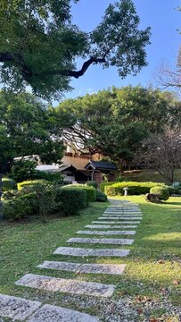 Stepping stone path through a manicured traditional garden