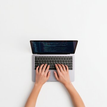 Developer hands typing software code on a laptop as a programmer at a desk