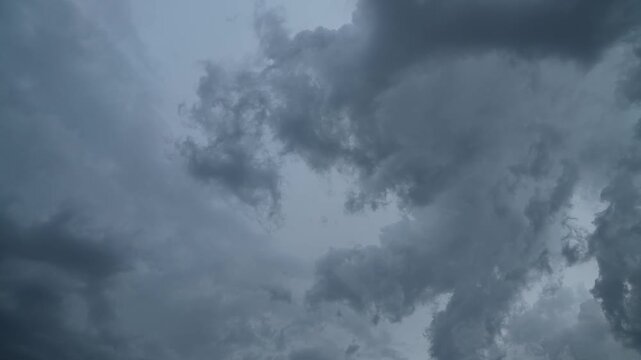 A dramatic cinematic video footage of a stormy sky with dark clouds, perfect for adding a sense of drama and tension to your project.
