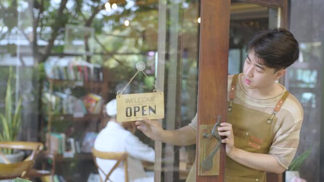 Small business cafe restaurant owner entrepreneur managing storefront with open or closed sign, young barista working daily routine with customer interaction, business operation in local coffee shop