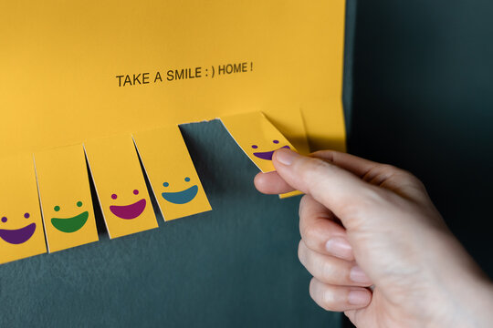Yellow note with smiling faces.kindness, emotional support, empathy, sharing happiness