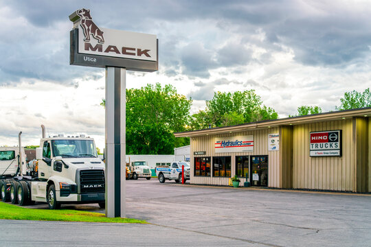 Marcy, NY - Jun 18, 2026: Evening view of Mack Utica truck dealership located at 9580 River Road, Marcy, NY 13403, part of Mack Trucks, a heavy‑duty truck manufacturer 