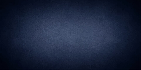Dark blue textured background with subtle spotlight effect, perfect for creating mood and depth. © MUSCLE