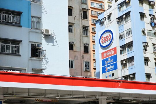 Hong Kong, China - July 01, 2026: Esso Gas Station Signage in Dense Urban Residential Area of Hong Kong.