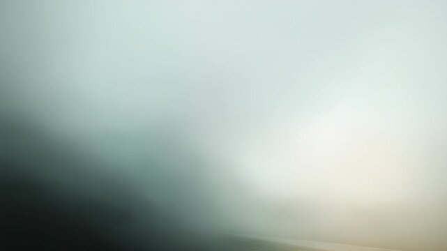 Soft misty haze with subtle light diffusion creates a tranquil and ethereal mood in this abstract image. Ideal for backgrounds, web design, and artistic compositions seeking a peaceful vibe