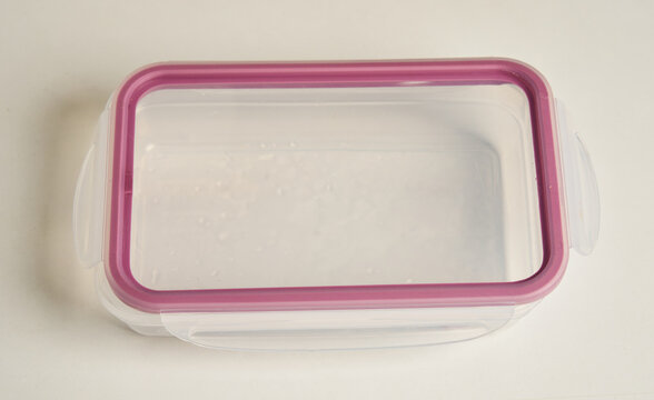 Plastic food storage container with locking lid isolated on white background
